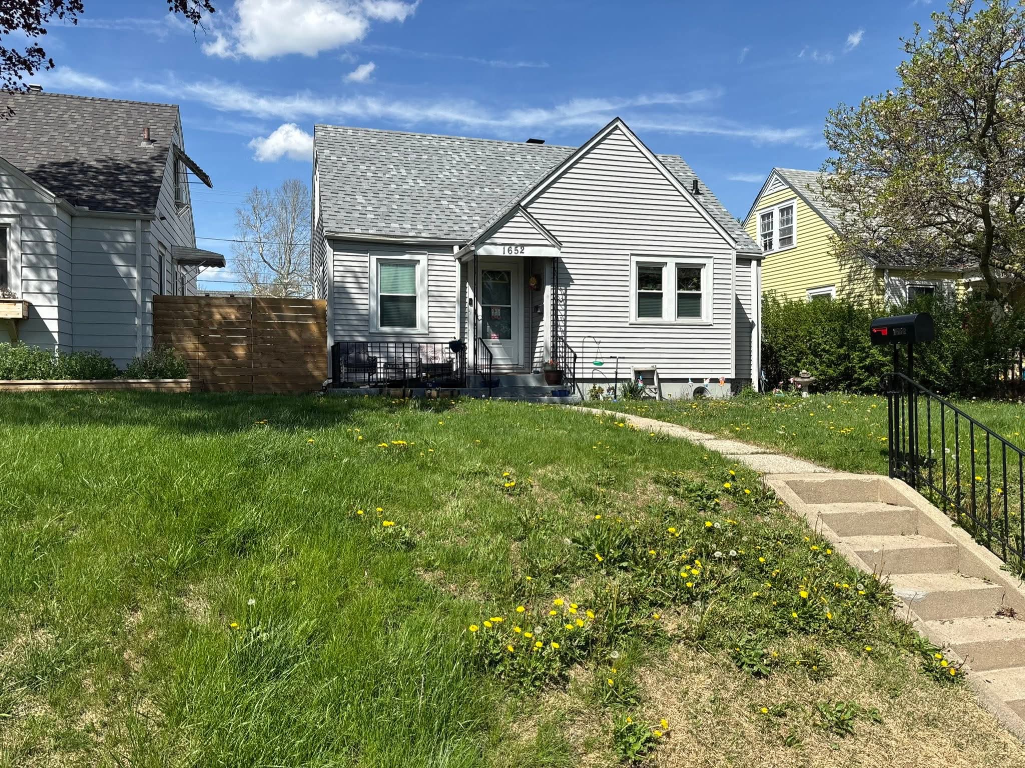 Weed-heavy lawn at House 1652