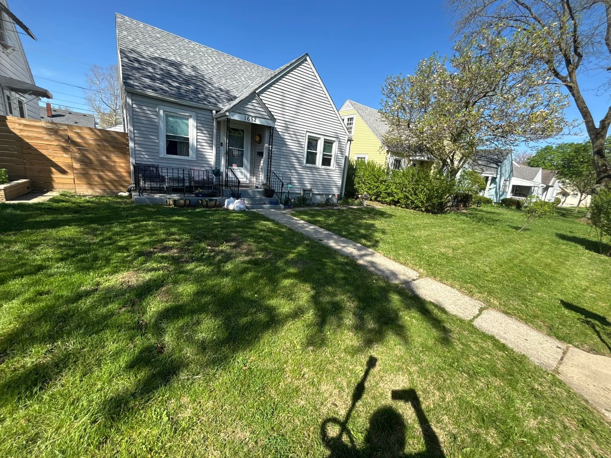 Clean, healthy lawn at House 1652 after treatment